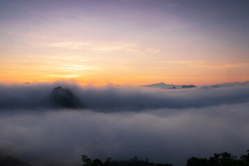 The beautiful early morning sky with twilight and waves of fog of Baan Ja Bo village viewpoint Pang Mapha, Mae Hong Son, Northern Thailand. 