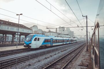 Modern electric train waiting on the staion of Ljubljana on a winter evening, waiting to start commuter service towards Kocevje, Slovenia.