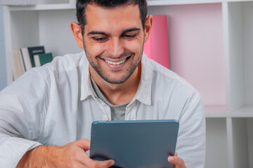 man at home with digital tablet or e-book