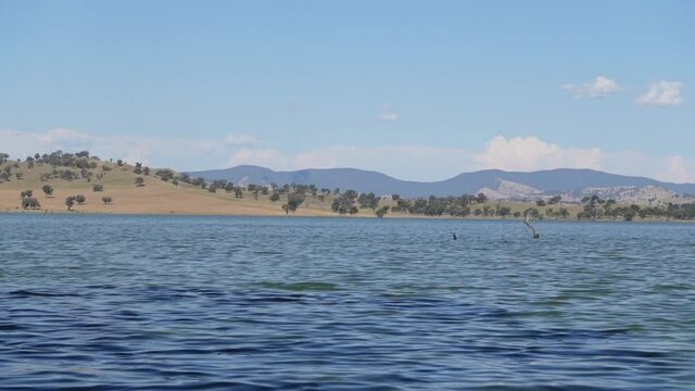 The blue sky with dark blue river of the Murray River, is a river in south-eastern Australia. It is Australia's longest river at 2,508 km, which covers about one-seventh the area of Australia.