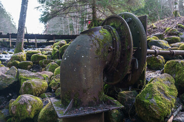 The mechanisms of the old mill on the stream. 