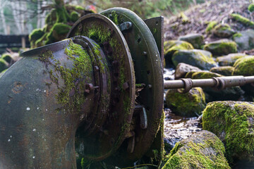 The mechanisms of the old mill on the stream. 