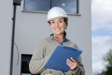 female construction woman using electronics on construction site