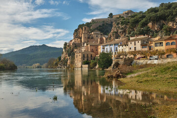 Miravet village and its Templar castle on top of the hill on the banks of the Ebro river,...
