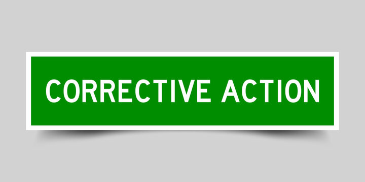 Square label sticker with word corrective action in green color on gray background