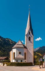 Fototapeta na wymiar Beautiful church on a sunny summer day at Bichlbach, Tyrol, Austria