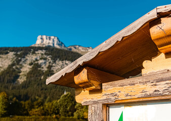 Details of a wooden panel with the famous Loser summit in the background at the Ausseer See lake near Altaussee, Steiermark, Austria