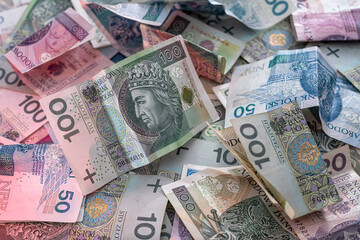 Obraz na płótnie Canvas Layout of large bills of polish zloty as finance background