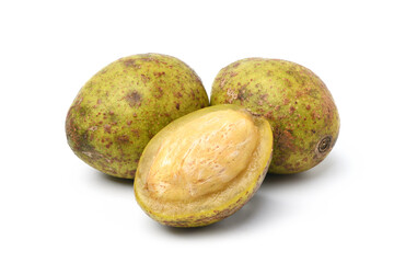 Hog plum fruits with cut in half isolated on white background. (Wild mango, Spondias pinnata)