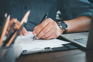 Close-up of Hand using writing pen with questionnaire or paperwork survey question filling in business company personal information form checklist document. - obrazy, fototapety, plakaty