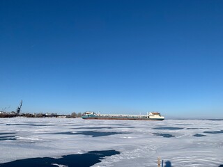 a view of the ships in the winter anchorage on the Volga River in ice and covered with snow