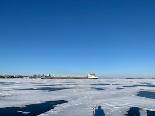 a view of the ships in the winter anchorage on the Volga River in ice and covered with snow