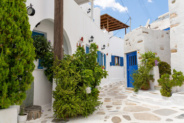 Corner with white houses and flowers in Prodromos, Paros, Greece