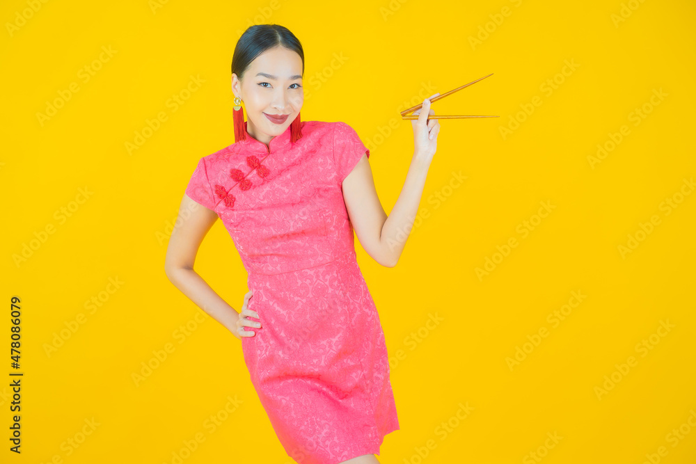 Wall mural portrait beautiful young asian woman with chopsticks