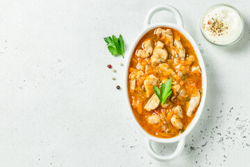 Classic comfort food goulash in pot. Top view, copy space.