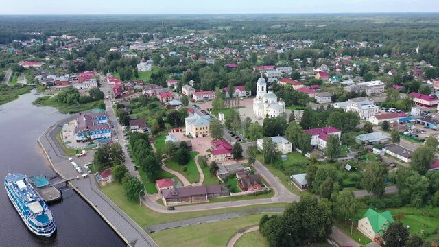 Aerial panoramic view of Russian town of Myshkin on banks of Volga River on summer day overlooking Assumption Cathedral and Nikolskaya church, Yaroslavl Oblast