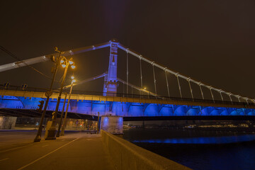 Fototapeta premium Crimean bridge in the fog at night. Night city. Steel suspension bridge in Moscow.