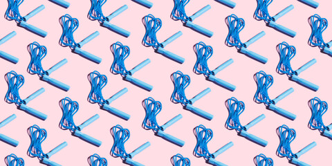 Blue Jumping rope on a pink background, seamless pattern. Fitness and sport, skipping rope