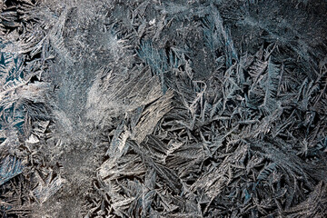 Winter drawing. Christmas background. Ice crystals on a glass.