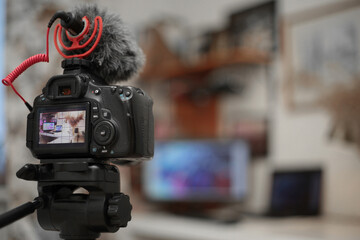 Digital camera with a microphone windshield in the room. Blogging equipment. Soft focus retro colors © sergeialyoshin
