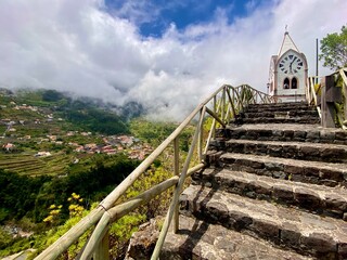 Capelinha de Nossa Senhora de Fatima church stairs big clock mountains clouds