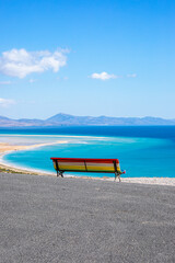 Ocean view poster. Sand beach and blue water og lagoon. 