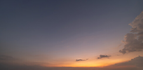 Sunset sky. Abstract nature background. Dramatic blue with orange colorful clouds in twilight time.