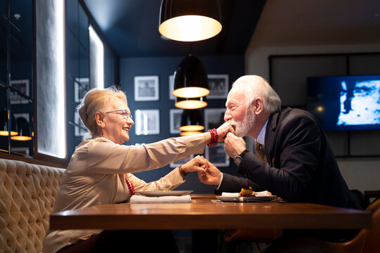 Senior Couple Enjoying Their Evening Together In A Restaurant