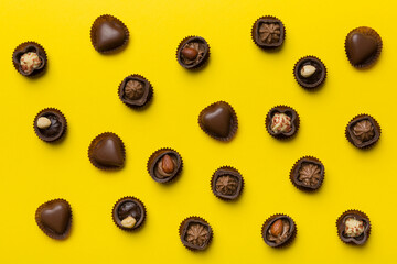Different kinds of chocolates on colored table close-up. Top View and Flat Lay