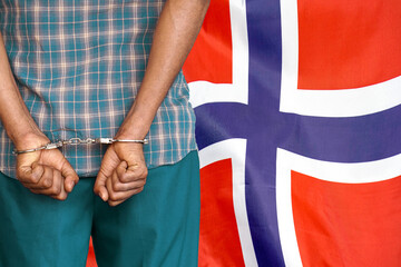 Male with handcuffs on the background of the Norway flag