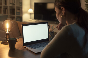 Woman watching videos on her laptop