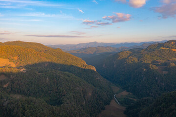 Aerial top view of forest trees and green mountain hills. Nature landscape background, Thailand.