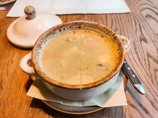 Traditional polish soup Zurek with sausage and eggs