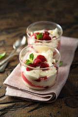 Homemade meringue trifle with custard and raspberries