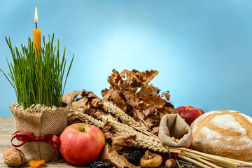Christmas oak tree, candle, bread and dried fruits