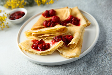 Homemade crepes with raspberry sauce