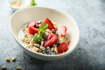 Healthy homemade muesli or oatmeal porridge with strawberry