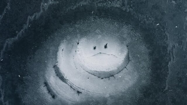 Top down view of empty frozen pond. Filmed in 4k, Drone video.