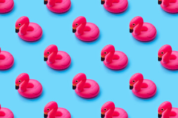 Summer pattern of float flamingo inflatable toy on bright blue background