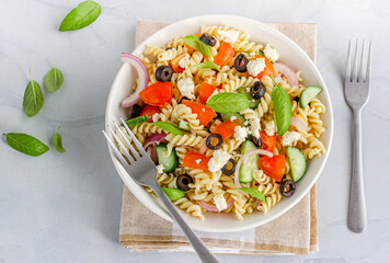 Top Down Photo of Fusilli Pasta Salad Garnished with Basil Leaves