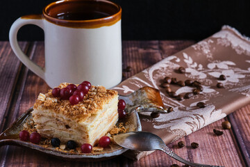 Homemade baked cake Napoleon, Millefeuille. Delicate custard cake garnished with berries. Against...