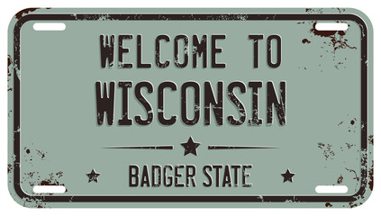 Welcome To Wisconsin Message On Damaged License Plate - obrazy, fototapety, plakaty