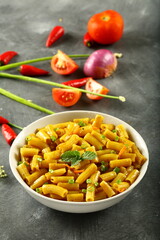 Homemade delicious pasta penne with fresh cheese and cream.