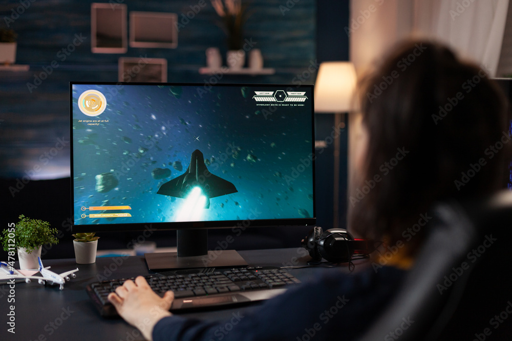 Aufkleber gamer using keyboard to play digital video games. woman playing online game with control console on 