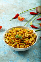 Bowl delicious vegan diet meal- cheese pasta penne with herbs.