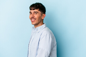 Young mixed race man isolated on blue background confident keeping hands on hips.