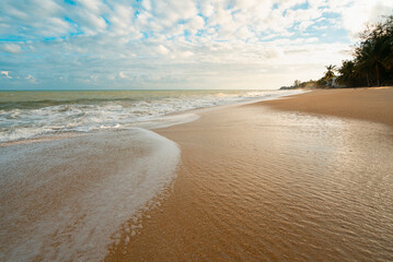 White clouds in the blue sky over tropical beach