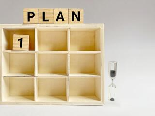Plan text on wooden blocks background. Strategy concept. Stock photo.