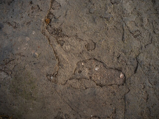 imagen textura de una piedra marrón con distintas marcas de quiebras 