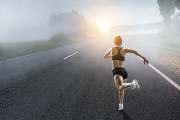 Fototapeta na wymiar Woman running against natural landscape